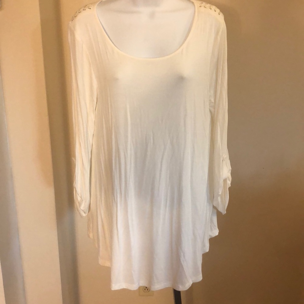 Ivory tunic with detailing at shoulder